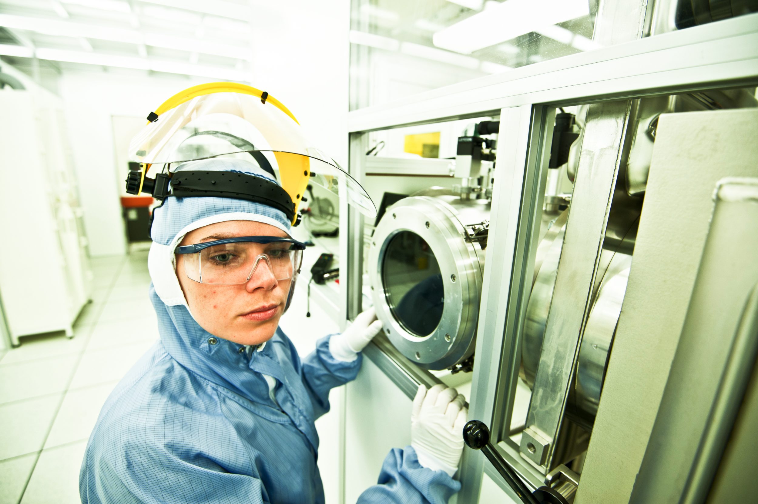 medical device regulation being tested by Woman Scientist Pose in Cleanroom/Laboratory